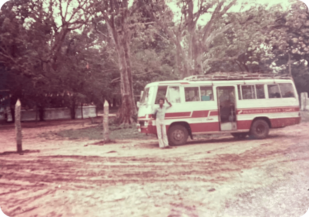 The founder of Panduwasnuwara Tours standing in front of the first coach, registration 29 Sri 3501